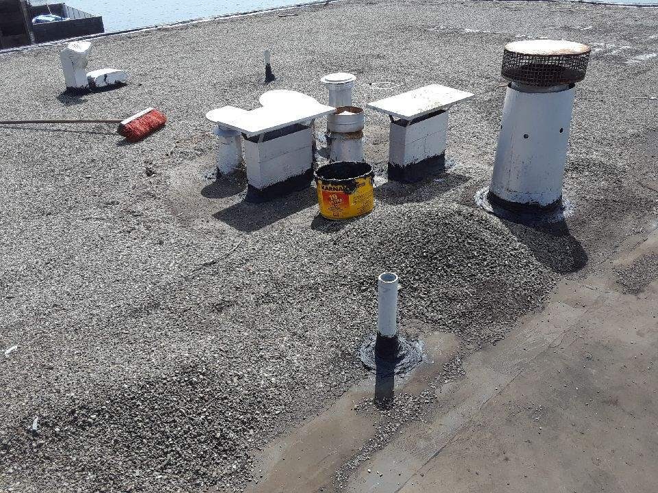 Commercial flat roof with vents and flashing