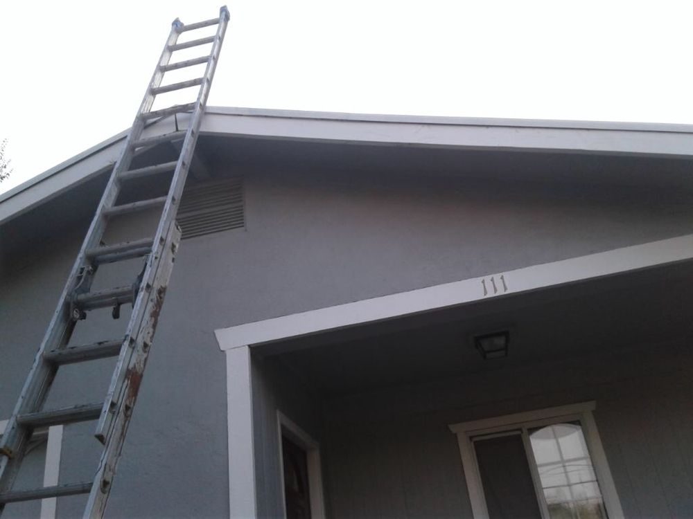 Painting contractor Knoxville TN: ladder set against an exterior wall and trim